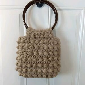 Tan knitted yarn handbag with two ring handles